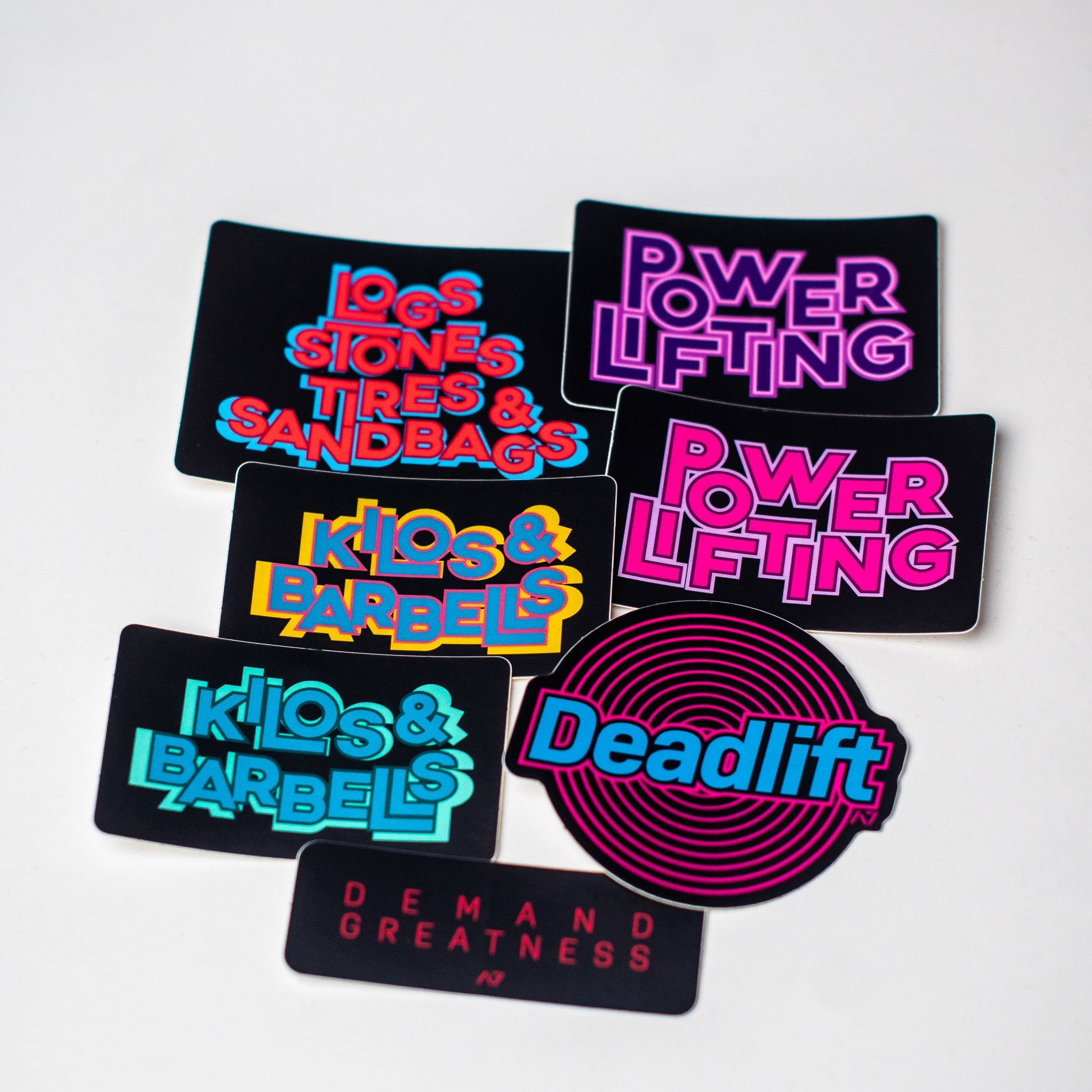 A7 Kilos and Barbells Aqua combines the dark with the fun and colourful designs to bring that pop of colour into the daily workouts. The sticker dye-cut, made from durable polypropylene and is 3 in wide x 2 in high. Purchase Kilos and Barbells Aqua Sticker from A7 UK.