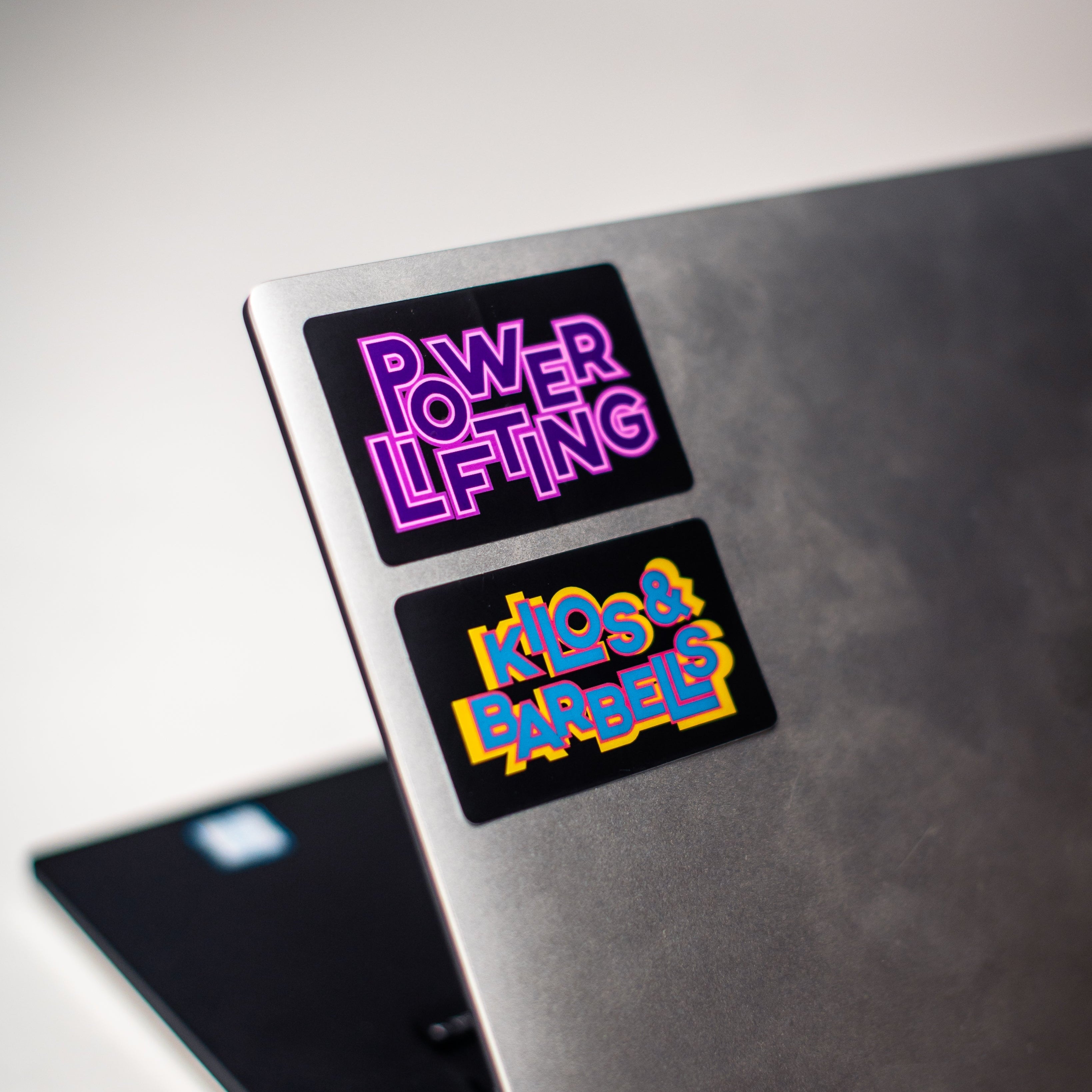 A7 Kilos and Barbells Overtone Sticker combines the dark with the fun and colourful designs to bring that pop of colour into the daily workouts. The sticker dye-cut, made from durable polypropylene and is 3 in wide x 2 in high. Purchase Kilos and Barbells Overtone Sticker from A7 UK.
